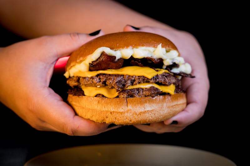 Hangry Joe's hot chicken with signature sauce drizzle